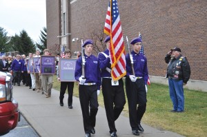 The Elder Honor Guard, and others process with 12 shadow boxes honoring those from Elder who died in Vietnam. (Courtesy Photo)