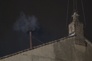 Black smoke billows from the chimney of the Sistine Chapel