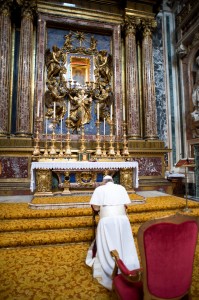 Newly elected Pope Francis prays in front of icon at Rome basilica
