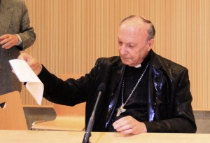 Belgian archbishop reacts after activist threw water on him during debate at university in Brussels