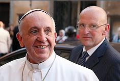 Pope Francis smiles as he greets the crowd upon arriving to celebrate a private Mass at the Church of the Gesu in Rome July 31. Watching the crowd is Domenico Giani, the pope's lead bodyguard. (CNS photo/Paul Haring) Pope Francis smiles as he greets the crowd upon arriving to celebrate a private Mass at the Church of the Gesu in Rome July 31. Watching the crowd is Domenico Giani, the pope's lead bodyguard. (CNS photo/Paul Haring)