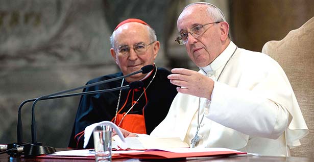 Pope Francis speaks next to Cardinal Agostino Vallini during visit Basilica of St. John Lateran in Rome