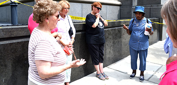A group of women pray the rosary outside of the Potter Stewart Courthouse in downtown Cincinnati on Wednesday, Aug. 6. The women pictured were part of a prayer gathering that took place as judges inside began a review of several marriage-related cases. (CT Photo/John Stegeman)