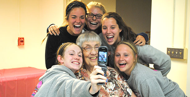Sister of Notre Dame de Namur Damienne Grismer enjoys a visit with MND students as part of the Adopt-A-Sister Club.  (CT Photo/Walt Schaefer)