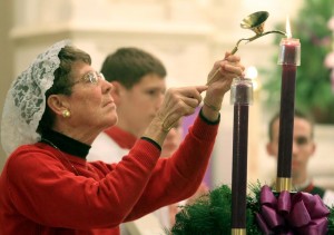 Sharon Borgert, Consecrated Virgin in the World, lights an Advent candle during the Mass for the Opening of the Year of Consecrated Life at Emmanuel Catholic Church in Dayton Sunday, Nov. 30, 2014. (CT Photo/E.L. Hubbard)