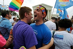 Gay rights supporters celebrate outside the U.S. Supreme Court building in Washington June 26 after the justices ruled in a 5-4 decision that the U.S. Constitution gives same-sex couples the right to marry. (CNS photo/Jim Bourg, Reuters) 