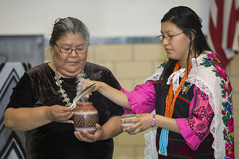 Star, Acoma, and Sadie, Navajo, bless the room before a Navajo ceremony while their group was visiting its Cincinnati twinning partner, Sts. Peter and Paul in Reading. (CT Photo/Colleen Kelly)