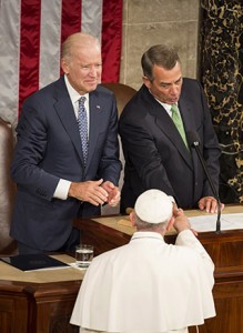 Pope Francis shakes hands with U.S. Speaker of the House John Boehner as U.S. Vice President Joe Biden looks on during a joint meeting of Congress on Capitol Hill Sept. 24 in Washington.  (CNS photo/Joshua Roberts) 