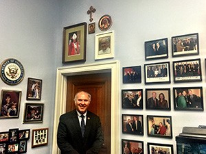 Congressman Steve Chabot poses for a photo in front of the "Pope Wall" in his Washington D.C. office. (CT Photo/Menachem Wecker)