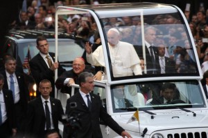 Pope Francis waves to the crowds as he approaches St. Patrick's Cathedral in New York City Sept. 24. Seated next to him is Cardinal Timothy M. Dolan of New York. (CNS photo/Gregory A. Shemitz) \