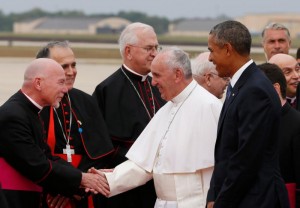 President Barack Obama walks beside Pope Francis as he greets dignitaries upon his arrival at Joint Base Andrews in Maryland just outside of Washington Sept. 22.  (CNS photo/Paul Haring)