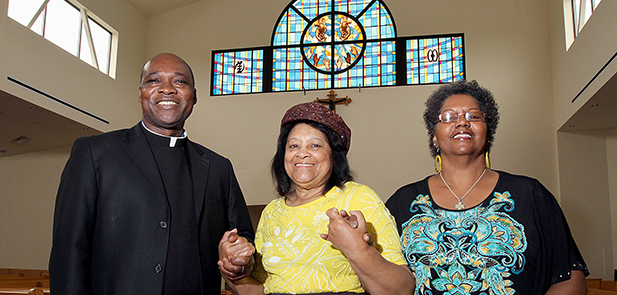 Father Francis Tandoh, pastor of St. Benedict the Moor, with parishioners Rita Ellicott and Juanita Newell. (Courtesy Photo)