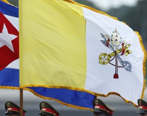 An honor guard carries the Cuban and Vatican flags during the arrival ceremony for Pope Francis at Jose Marti International Airport in Havana Sept. 19. (CNS photo/Paul Haring) 