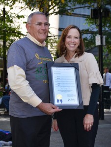St. Rita Executive Director Gregory Ernst, left, with Cincinnati City Councilwoman Amy Murray and a proclamation naming Oct. 14, 2015, St. Rita School for the Deaf Day in Cincinnati. (CT Photo/John Stegeman)