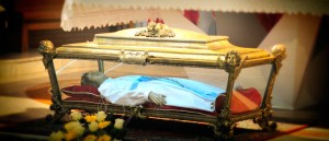 St. Maria’s remains are inside a glass-sided casket.  Inside the casket is a wax statue within which repose her skeletal remains. (Courtesy Photo)