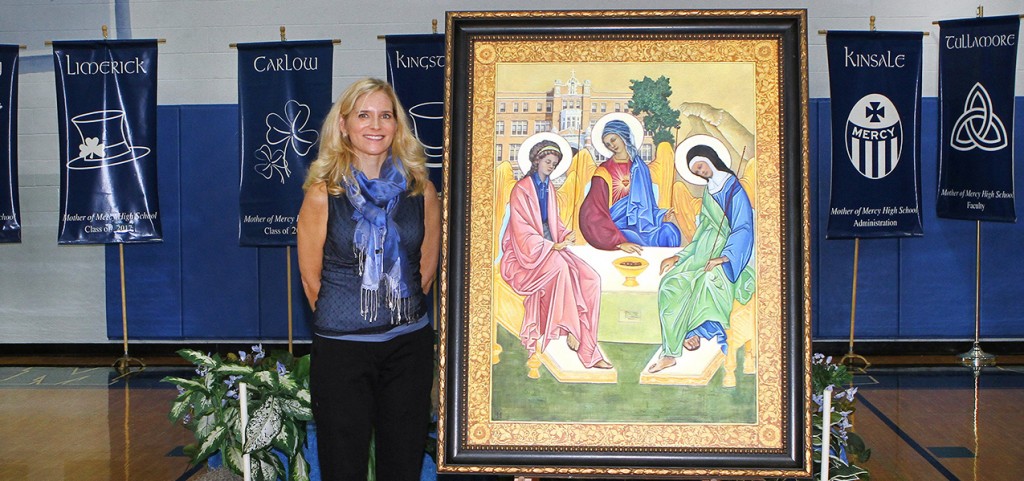 Artist and Mercy alumna Holly Schapker unveils her painting honoring Mother of Mercy’s 100 years. (Courtesy Photo)
