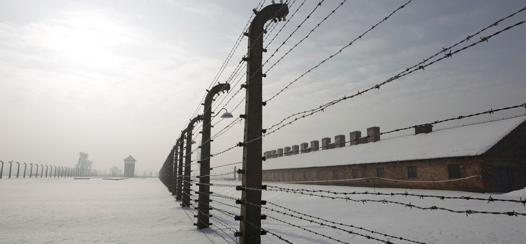 Barbed wire fences are pictured in a snowy scene at the former Auschwitz-Birkenau death camp in Oswiecim, Poland, Jan. 27, 2010. (CNS photo/Peter Andrews, Reuters)