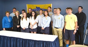 Archbishop Dennis M. Schnurr poses for a photo with Lehman Catholic High School students after his Catholic Schools Week teleconference. (CT Photo/John Stegeman)