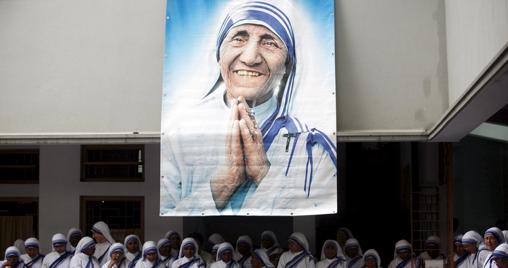 A poster of Blessed Teresa of Kolkata and Missionaries of Charity are seen in Kolkata, India, in this Sept. 5, 2007, file photo. Pope Francis will declare her a saint at the Vatican Sept. 4, the conclusion of the Year of Mercy jubilee for those engaged in works of mercy. (CNS photo/Jayanta Shaw, Reuters) S