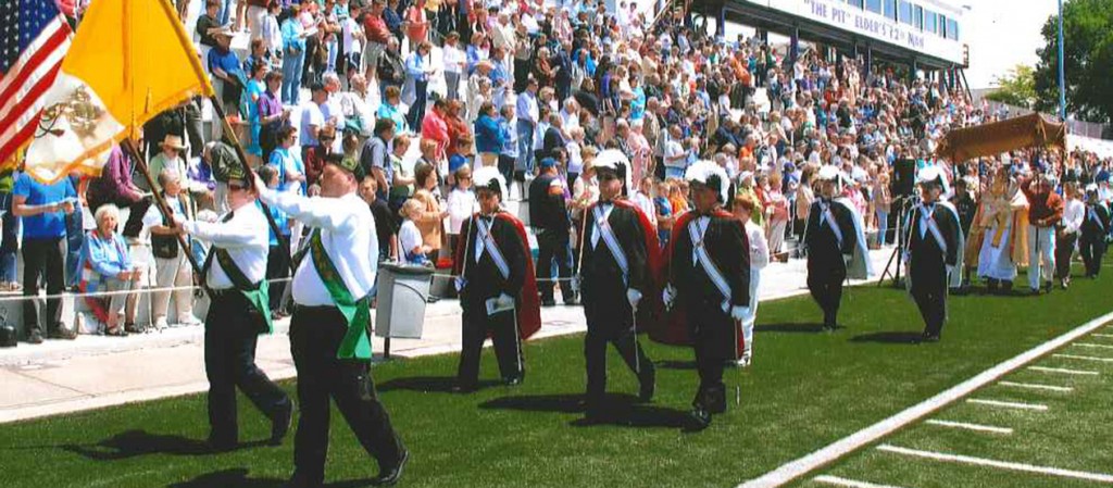 Fourth Degree Knights of Columbus march in formation behind Hibernian flag bearers during the 2009 Family Rosary Rally at Elder High School. Beginning with this year's event, the Purcell Council of the Knights will begin to take over planning the event. (Courtesy Photo)