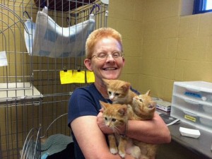Sister Eileen holds three of the kittens she fostered and socialized. (Courtesy Photo)