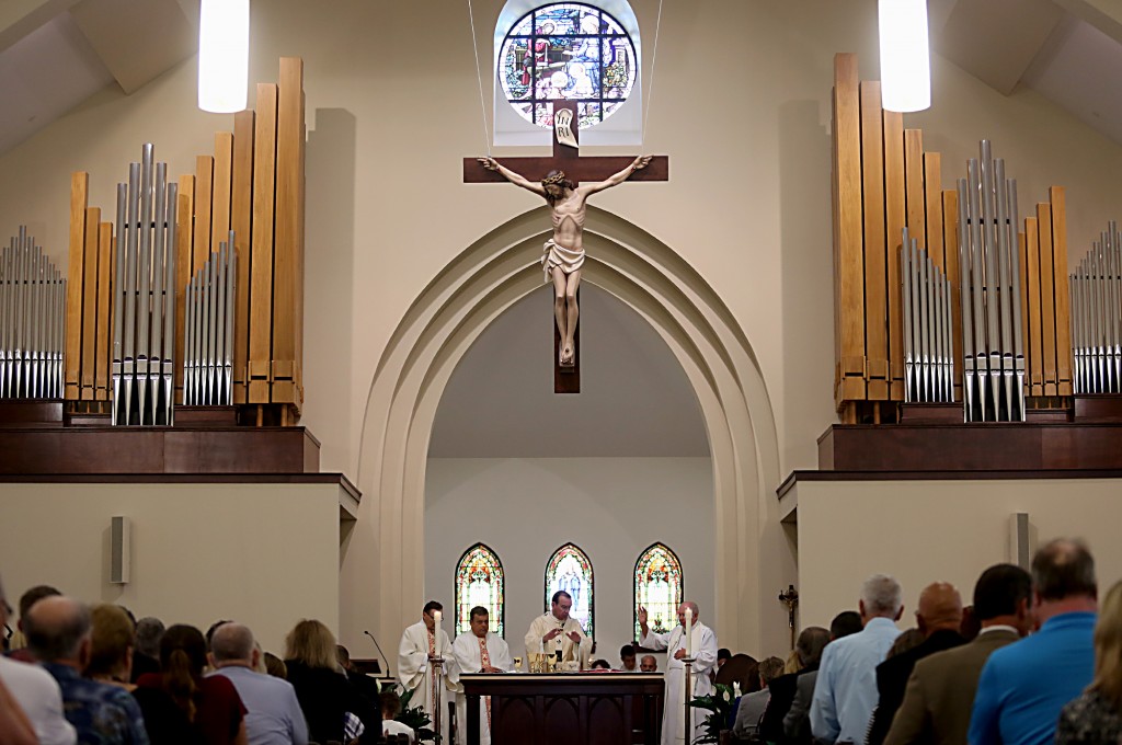 Archbishop Dennis Schnurr prepares the Eucharist during the St. Mary of the Assumption Mass of Dedication in Springboro Sunday, August 14, 2016. (CT Photo/E.L. Hubbard)