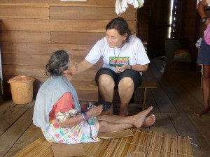 Sister Rebeca Spires, who has served in the Brazilian interior since 1970, tends to a blind woman. (Courtesy Photo)