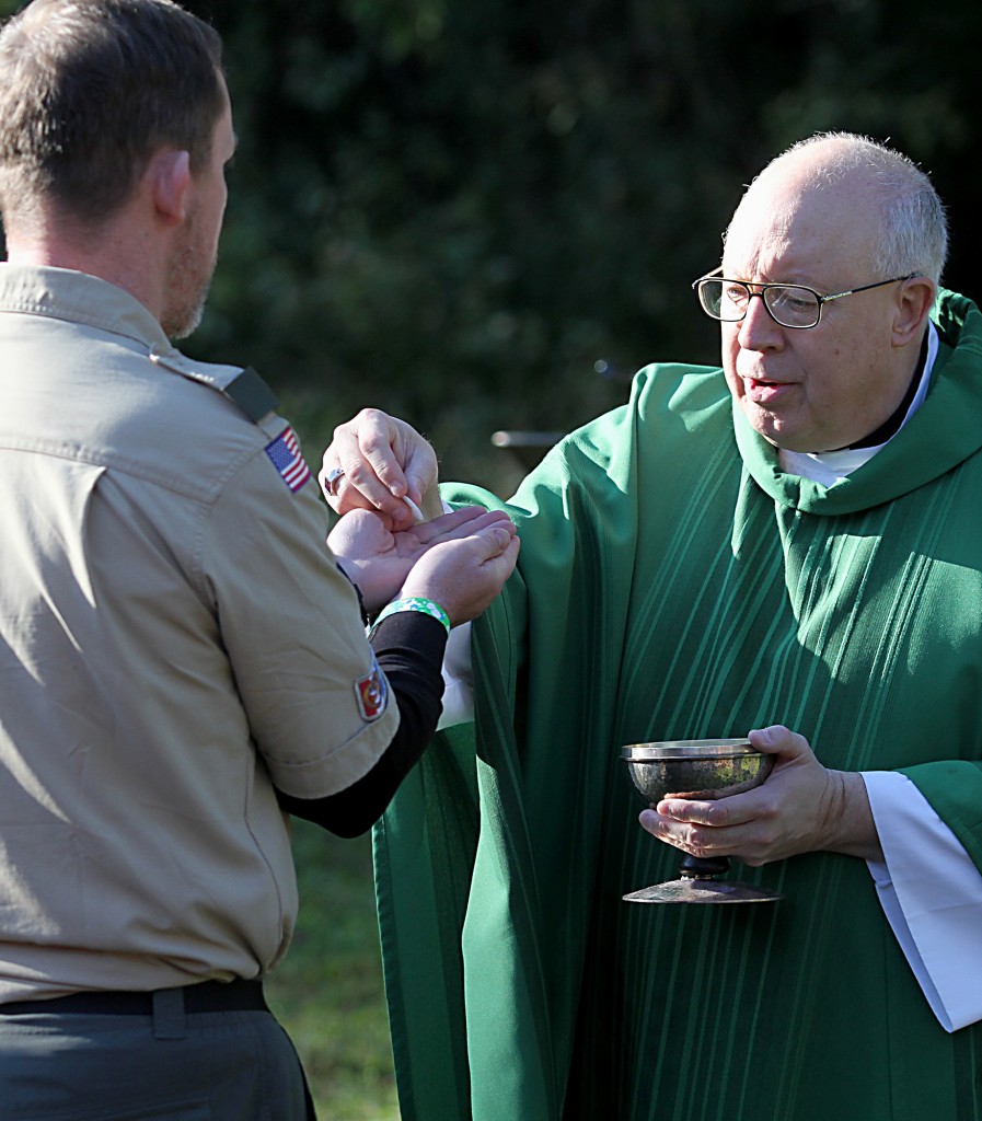 Bishop Joseph Binzer offers the Holy Eucharist during the Peterloon Camporee Mass at Camp Friedlander in Loveland Sunday, October 9, 2016. (CT Photo/E.L. Hubbard)