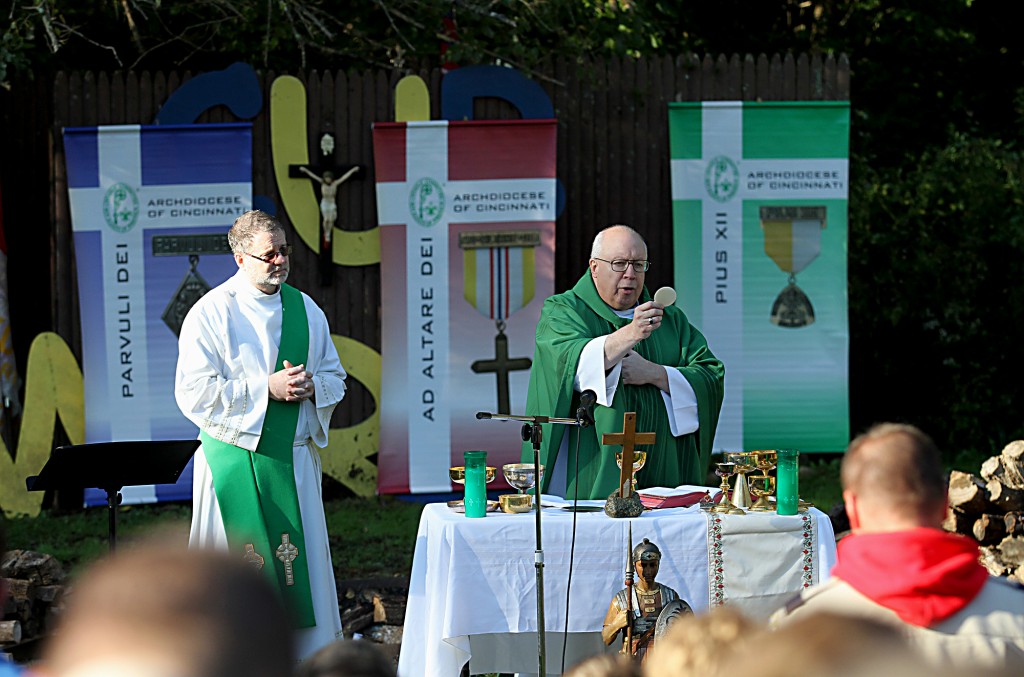 Bishop Joseph Binzer prepares the Eucharist during the Peterloon Camporee Mass at Camp Friedlander in Loveland Sunday, October 9, 2016. (CT Photo/E.L. Hubbard)