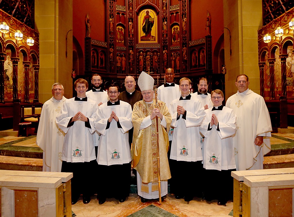 From Left to Right: Father Benedict O’Cinnsealaigh, Christopher Komoroski, Jeremy Stubbs, David Carvajal Casal, Ryan Furlong, Bishop Emeritus Edward J. Slattery, Benson Lokidiriyo, Robert Healey, Andrew Reckers, Kirby Rust and Father Anthony Brausch. (Photo by E L Hubbard)