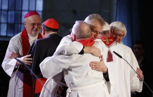 The Rev. Martin Junge, general secretary of the Lutheran World Federation, embraces Bishop Munib Younan of the Evangelical Lutheran Church, president of the Lutheran World Federation, front center, during an ecumenical prayer service at the Lutheran cathedral in Lund, Sweden, Oct. 31. At right, Pope Francis embraces Archbishop Antje Jackelen, primate of the Lutheran Church in Sweden. At left is Bishop Anders Arborelius of Stockholm and Cardinal Kurt Koch, president of the Pontifical Council for Promoting Christian Unity. (CNS photo/Paul Haring) 