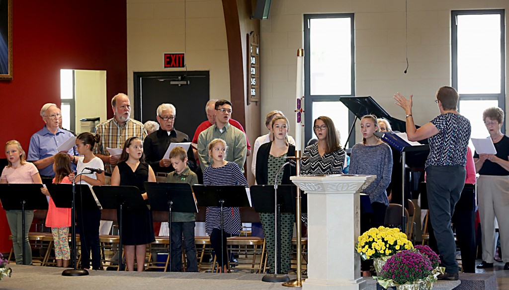 The choir sings during the Queen of Peace Catholic Church 75th Anniversary Mass on Sunday, October 2, 2016, in Millville, Ohio.