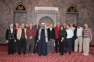 Priests and brothers from Glenmary Home Missioners pose for a photo with representatives from the Islamic Center of Greater Cincinnati Nov. 29 in the center's prayer hall. (Photo Courtesy of Glenmary/John Stegeman)