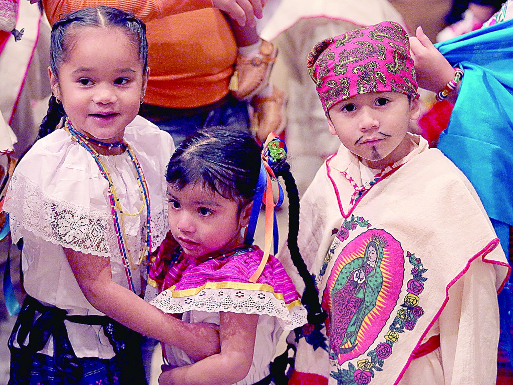 Children wear costumes during the Feast of Our Lady of Guadalupe at St. Julie Billiart parish in Hamilton Sunday, Dec. 11, 2016. The Day of Prayer was to focus on the plight of refugees and migrants across the United States. (CT Photo/E.L. Hubbard)