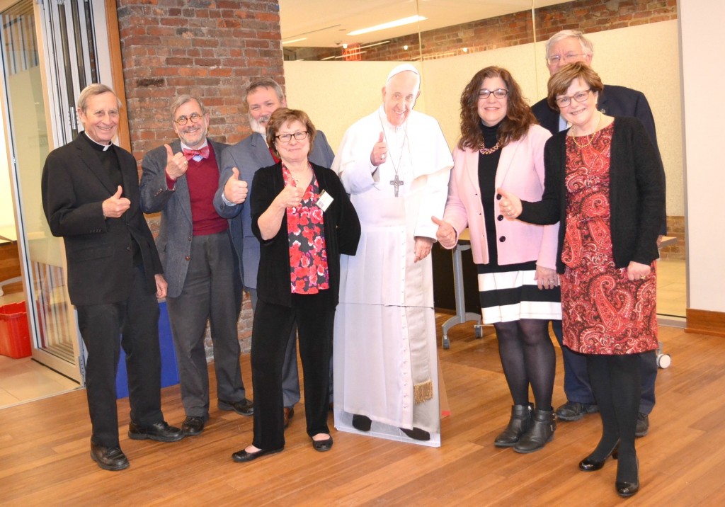 Recipients of the Guild’s Communicator of the Year award pose with a cutout of Pope Francis. From left: Father. Bob Hater, Dan Andriacco, Michael Pitman, Elizabeth Bookser Barkley,, Marianne Zeleznik, John Keiswetter, Patricia Frey.