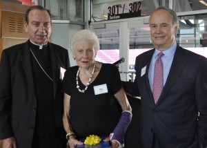 Archbishop Dennis M. Schnurr poses with Marj Valvano and George Elliott of the Cincinnati International Wine Festival. (Courtesy Photo)