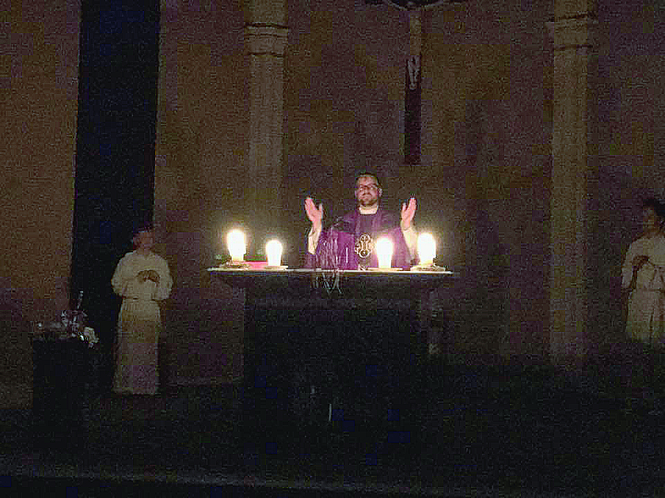 Strong Storms knocked out power to St. Andrew in Milford, so Mass was conducted under candlelight. (Courtesy Photo)