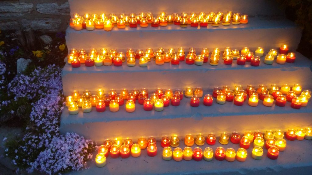 In the darkest hour when our Saviour was crucified, pilgrims pierce the darkness with votive candles. (Greg Hartman CT/Photo)