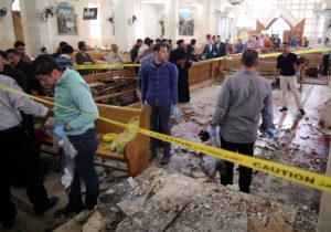 Security personnel investigate the scene of a bomb explosion April 9 inside the Orthodox Church of St. George in Tanta, Egypt. That same day an explosion went off outside the Cathedral of St. Mark in Alexandria where Coptic Orthodox Pope Tawadros II was presiding over the  Palm Sunday service. (CNS photo/Khaled Elfiqi, EPA)