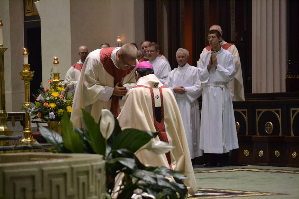 Reverend Doseck prays for Archbishop Dennis M. Schnurr. (CT Photo/Greg Hartman)