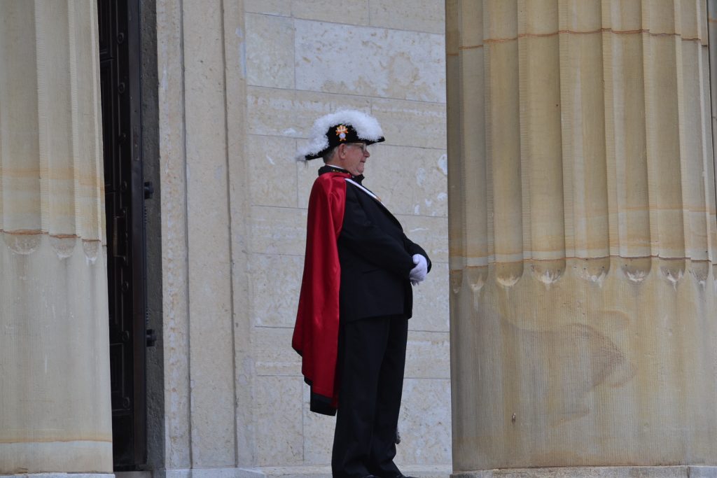 A Knight in the Knights of Columbus awaits the beginning of Ordination (CT Photo/Greg Hartman)