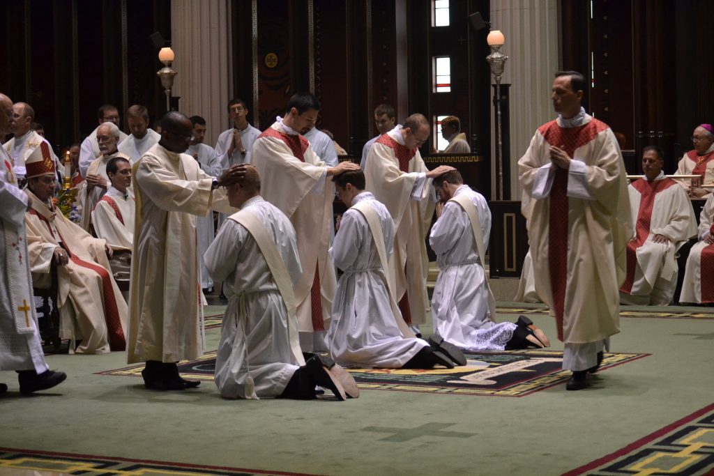The concelebrating priests in Laying on of Hands. (CT Photo/Greg Hartman)