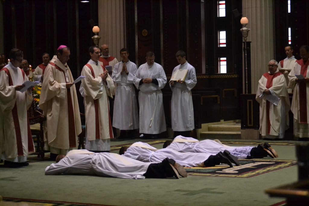 The candidates prostrate themselves while all sing the ancient prayer of the Church asking the saints to pray for God's blessing upon these candidates. (CT Photo/Greg Hartman