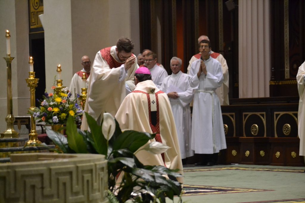 Reverend Witt prays for Archbishop Dennis Schnurr (CT Photo/Greg Hartman)