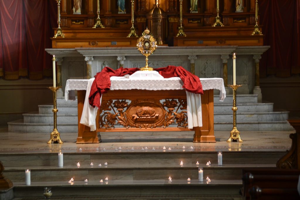 For prayer intentions candles were lit and placed on the alter below the Blessed Sacrament (CT Photo/Greg Hartman)