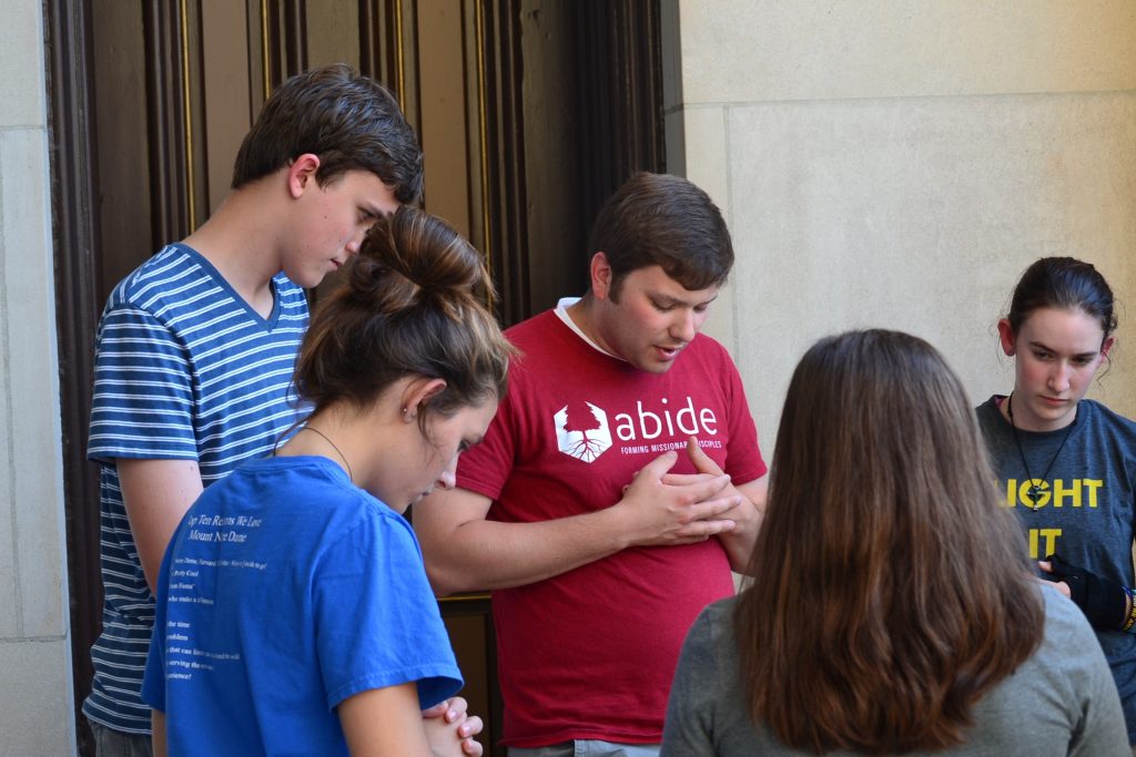 Groups began their night in prayer before takin it to the streets. (CT Photo/Greg Hartman)