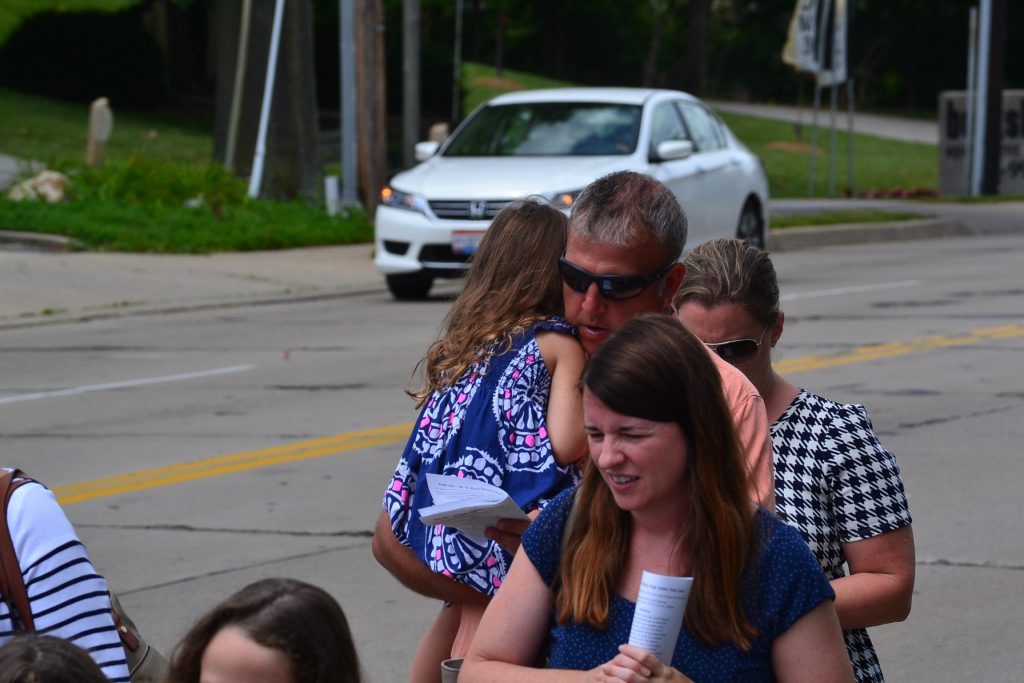 The 2017 Corpus Christi Procession was also on Father's Day, as Dad carries his daughter in the procession. (CT Photo/Greg Hartman