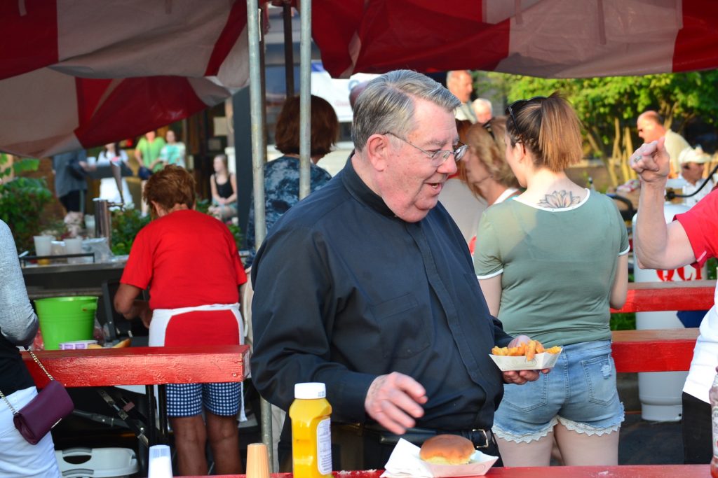 Fr. King enjoying a night at the festival (CT Photo/Greg Hartman)