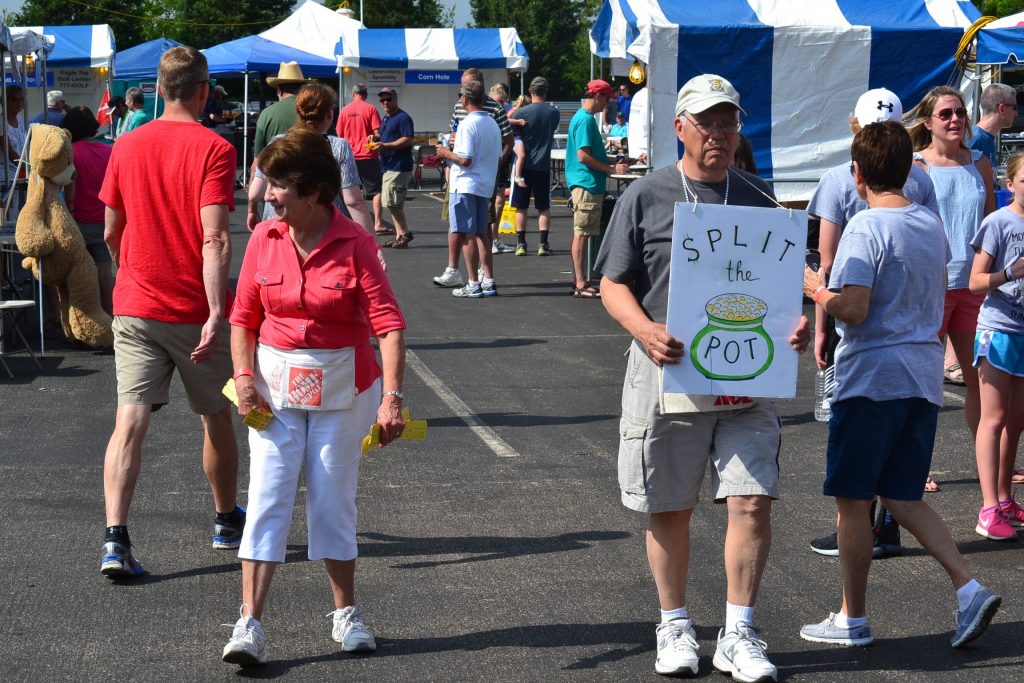 Walking the grounds drumminig up the next Split the Pot. (CT Photo/Greg Hartman)