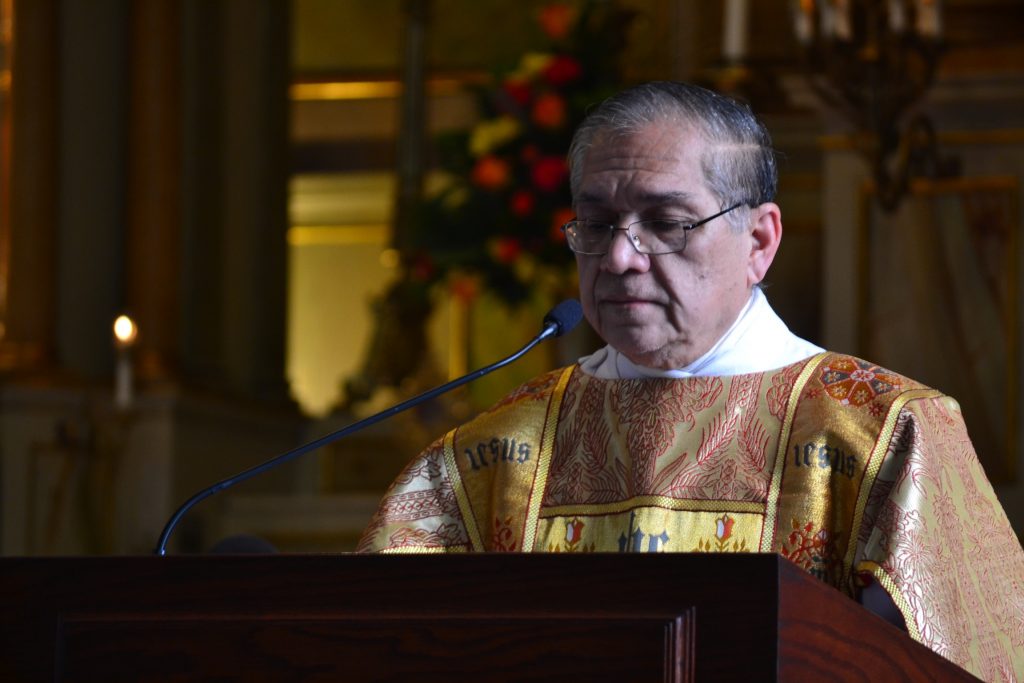 Fr. Lawrence Juarez, C.O. reads the Epistle, Revelation 21:1-5 (CT Photo/Greg Hartman)